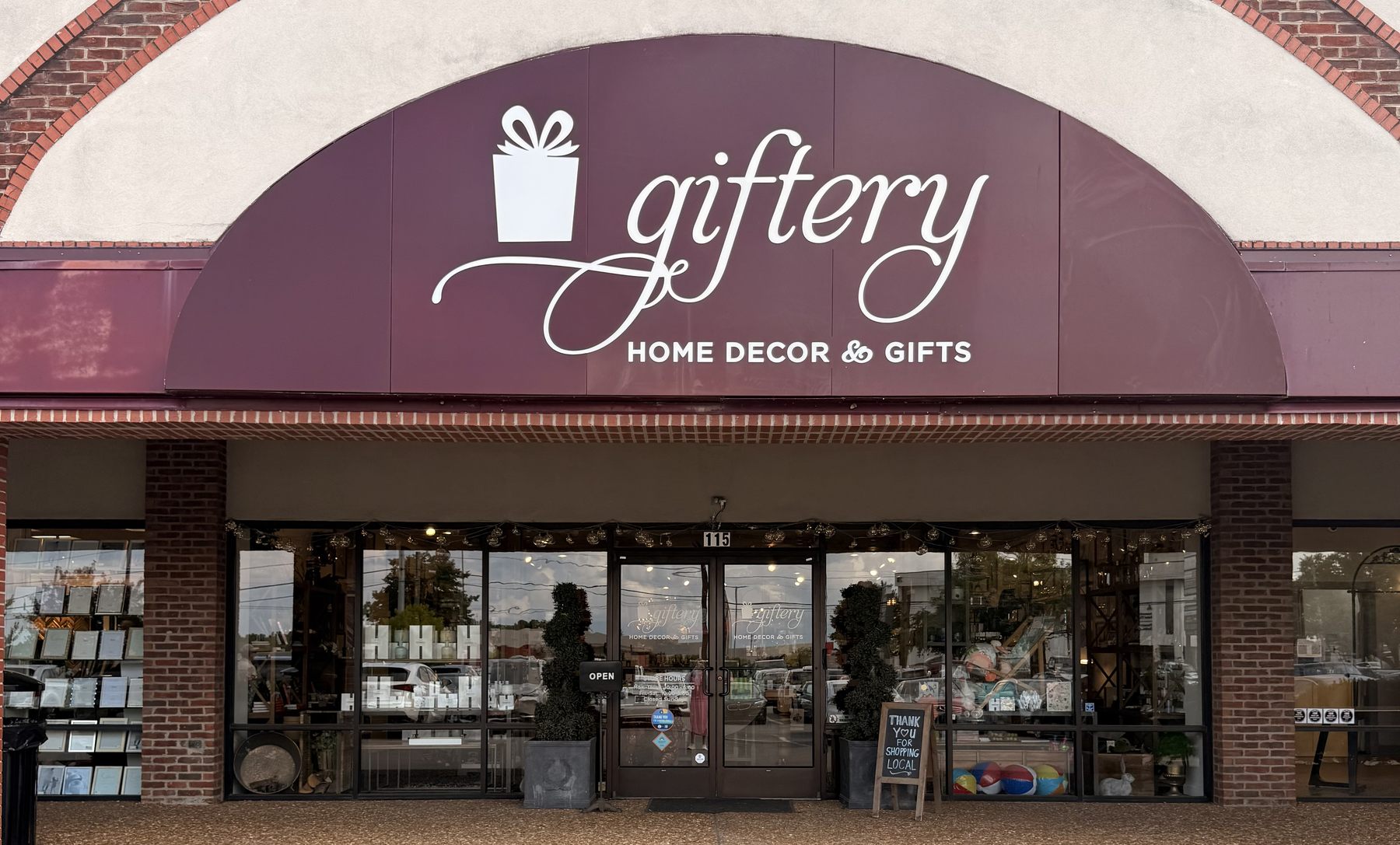 The Giftery storefront in Nashville, Tennessee, under its arched burgundy sign.