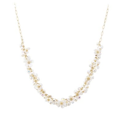 Meghan Browne Style Arlen statement necklace — gold with flowers and pearls, bestseller.